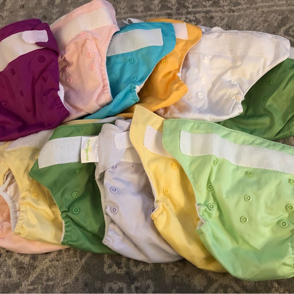 Set of Bum Genius cloth diapers and pads